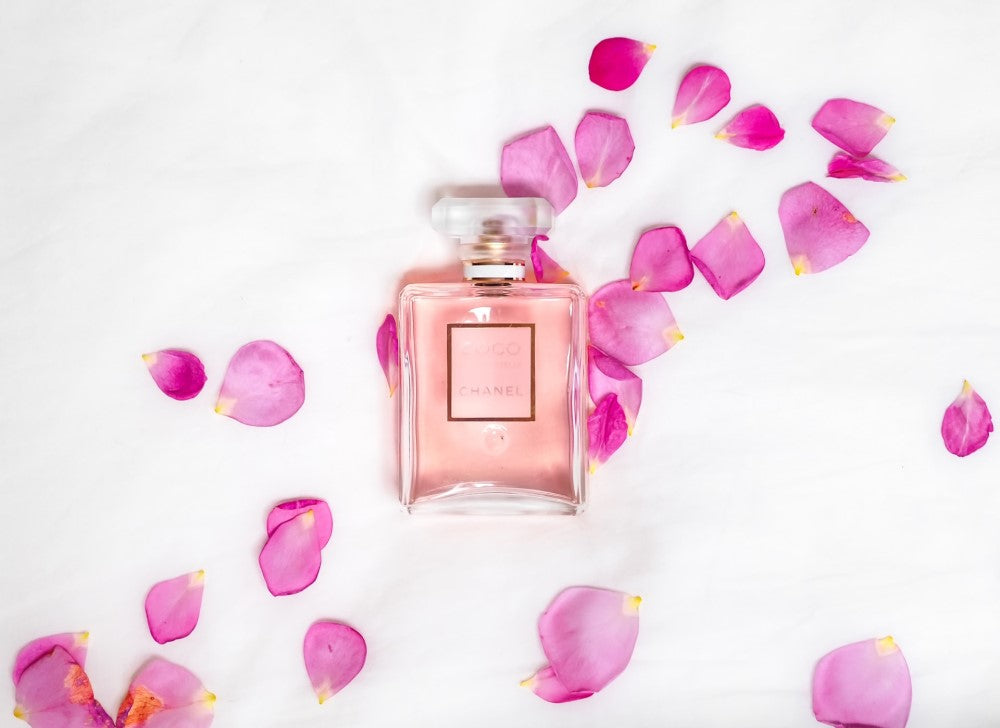 Perfume with rose petals